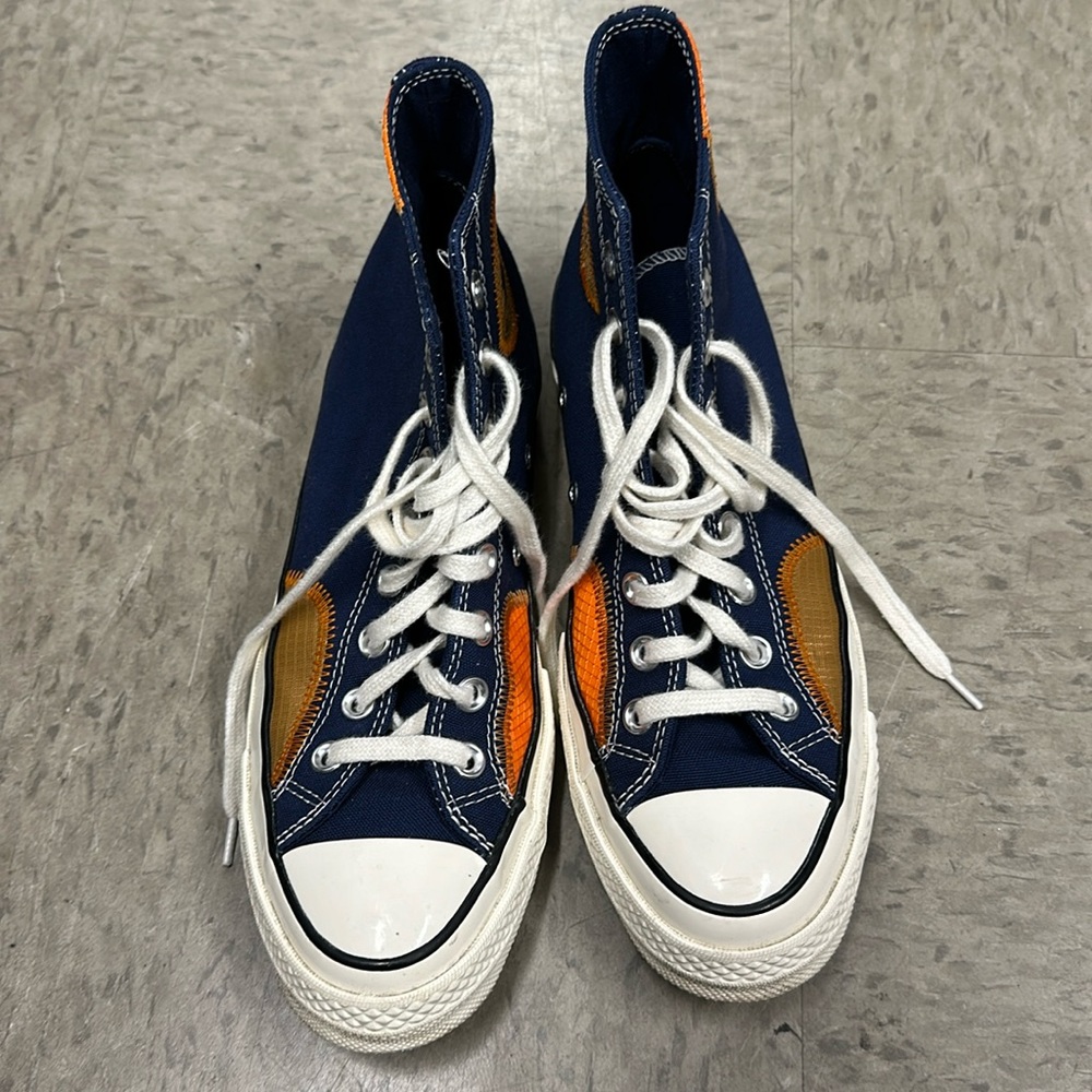Limited edition orange and navy blue Chuck 70s. Minimal wear.